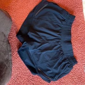 4 Reg 2.5 inch dark blue lululemon hotty hot shorts